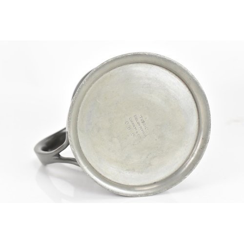 15 - A Liberty & Co Tudric Pewter tankard, designed by Oliver Baker, model No.066, having a planished bod... 