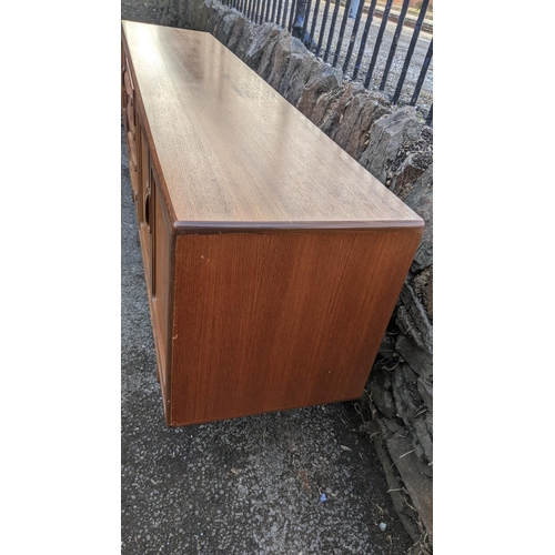 30A - A mid 20th century G-Plan Fresco range teak sideboard, designed by Victor B Wilkins, having four cen... 