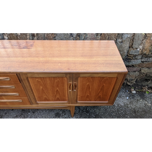 30A - A mid 20th century G-Plan Fresco range teak sideboard, designed by Victor B Wilkins, having four cen... 