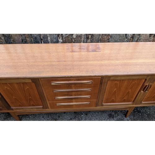 30A - A mid 20th century G-Plan Fresco range teak sideboard, designed by Victor B Wilkins, having four cen... 