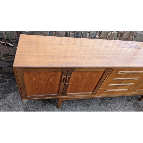 30A - A mid 20th century G-Plan Fresco range teak sideboard, designed by Victor B Wilkins, having four cen... 