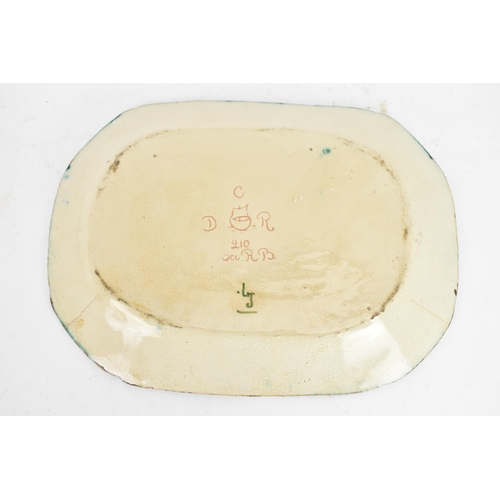 34 - A circa 1900 Della Robbia pottery meat plate, having a central flower head motif with branches termi... 