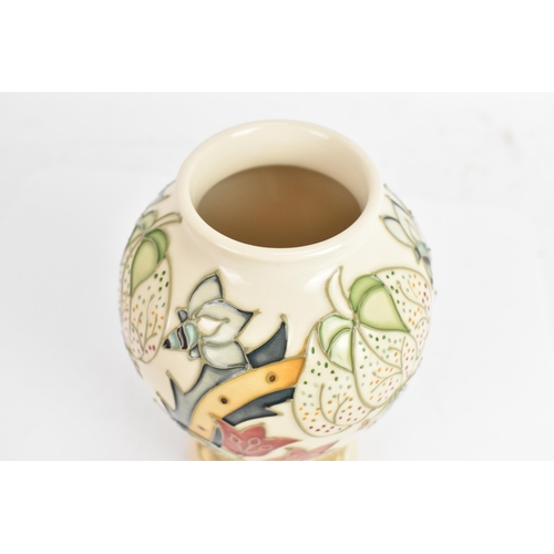 4 - A Moorcroft vase, in the 'Golden Lily' pattern, tube lined on an ivory ground and of baluster form, ... 