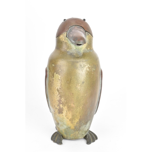 42 - A 1930s Chinese coffee pot, in the form of a penguin, having a hinged lid and pouring spout, the cas... 