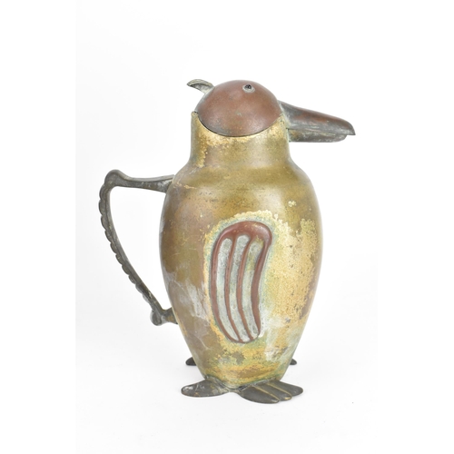 42 - A 1930s Chinese coffee pot, in the form of a penguin, having a hinged lid and pouring spout, the cas... 