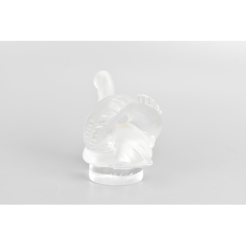 44 - A Lalique glass paperweight, fashioned as a frosted swan, the rim etched 'Lalique France', 5cm high ... 