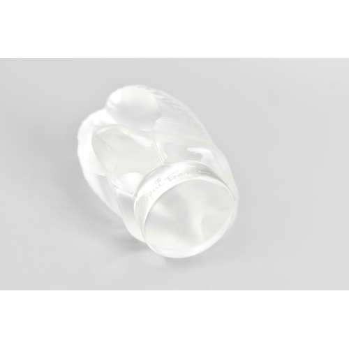 44 - A Lalique glass paperweight, fashioned as a frosted swan, the rim etched 'Lalique France', 5cm high ... 