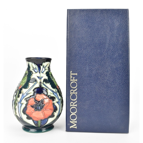 55 - A modern Moorcroft 'Poppy' pattern vase designed by Rachel Bishop, of baluster form, impressed and p... 