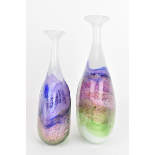 59 - Two Thomas Petit studio glass 'Moors' flattened bottle vases, each in shades of purple, pink and gre... 