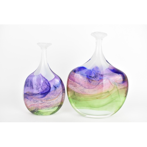 59 - Two Thomas Petit studio glass 'Moors' flattened bottle vases, each in shades of purple, pink and gre... 