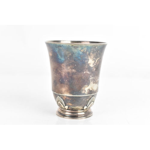 6 - A mid 20th century Georg Jensen silver beaker/cup, of tapering form with floral motifs and a single ... 