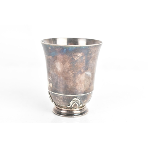 6 - A mid 20th century Georg Jensen silver beaker/cup, of tapering form with floral motifs and a single ... 