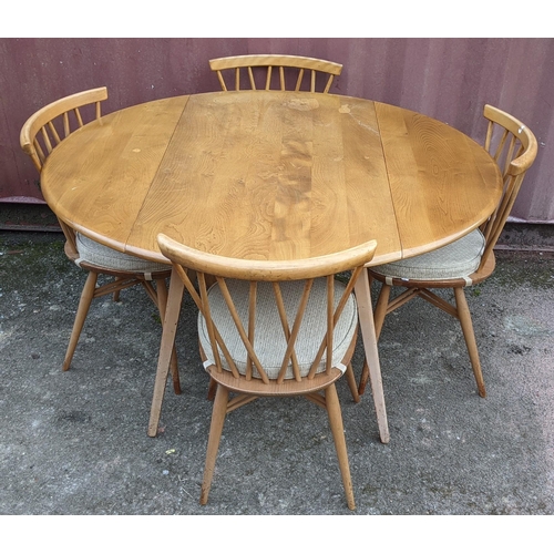 60A - A 1960s Ercol blond elm 'Windsor' model 384 fall flap kitchen table and four model 376 beech and elm... 