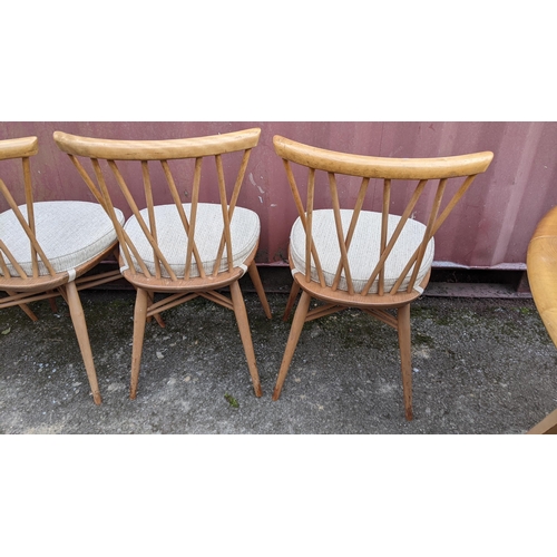 60A - A 1960s Ercol blond elm 'Windsor' model 384 fall flap kitchen table and four model 376 beech and elm... 