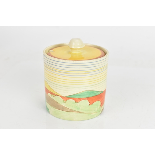 9 - An Art Deco Clarice Cliff drum shaped preserve pot and cover, having a black printed 'Clarice Cliff ... 