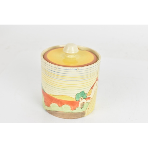 9 - An Art Deco Clarice Cliff drum shaped preserve pot and cover, having a black printed 'Clarice Cliff ... 