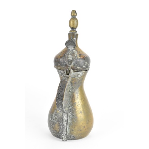 118 - A 19th century Dallah brass coffee pot, of hourglass form with an oversized spout, finial top with a... 