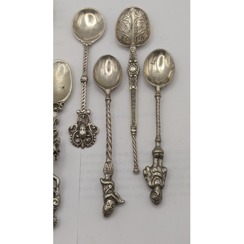 10 - A group of silver; 900 grade silver and 800 grade silver and white metal collector tea spoons to inc... 