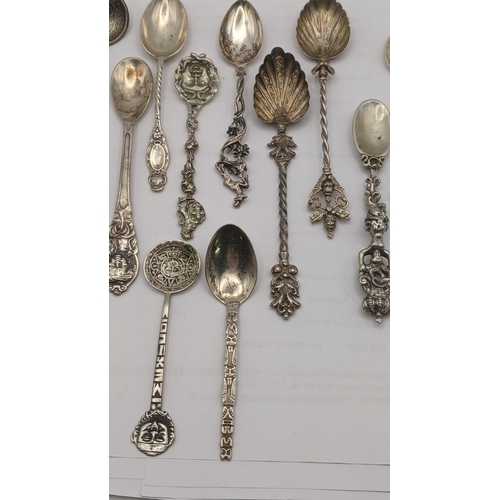 10 - A group of silver; 900 grade silver and 800 grade silver and white metal collector tea spoons to inc... 