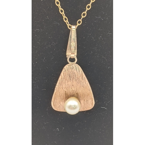 11 - A 9ct gold and pearl pendant on a yellow metal necklace tested as 9ct gold with a gold plated clasp,... 