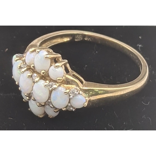 15 - An opal and diamond 9ct yellow gold cluster ring, size Q1/2, 2.7g
Location:
If there is no condition... 