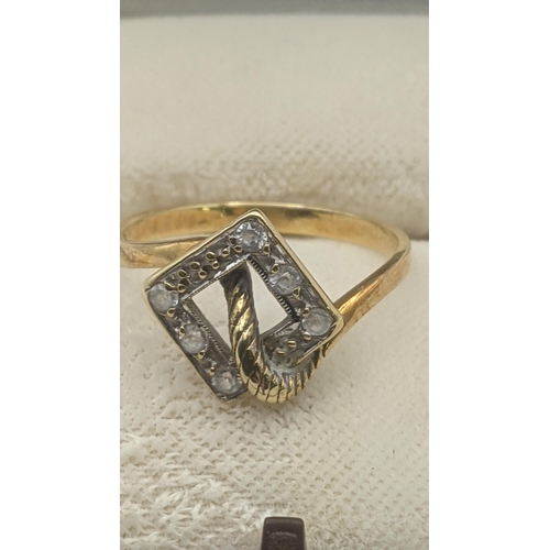 21 - An 18ct yellow and white gold art deco style ring set with paste stones 2.8g size P1/2
Location:
If ... 