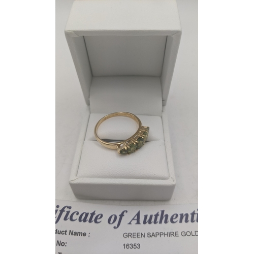 26 - A 14ct yellow gold and green sapphire ring size W, 3.9g, with certificate of authenticity
Location:
... 