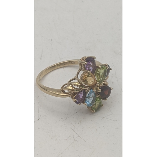 36 - A 9ct yellow gold multi gemstone set with garnet, amethyst, peridot, tanzanite and blue topaz cluste... 