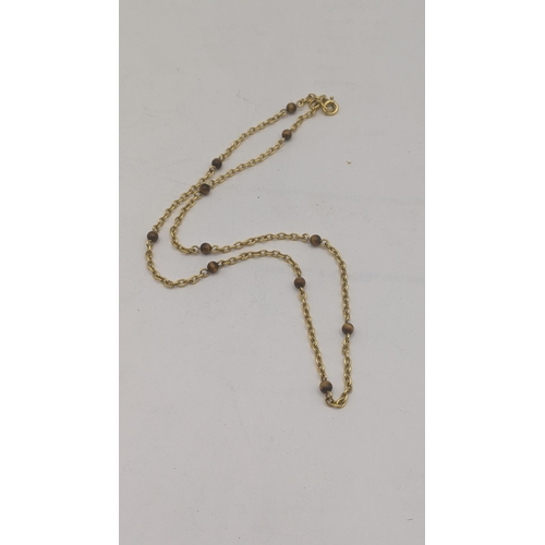 4 - A 9ct yellow gold and tiger eye chain link necklace 4.5g
Location:
If there is no condition report, ... 