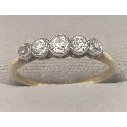 46 - A 5 stone diamond white and yellow metal ring, yellow metal tested as 18ct gold, 2.1g
Location:
If t... 