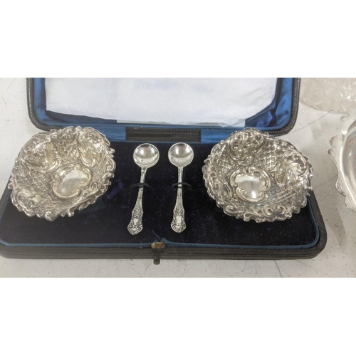 51 - A mixed silver and silver topped crystal cut glass items to include embossed pin dishes, a two-piece... 