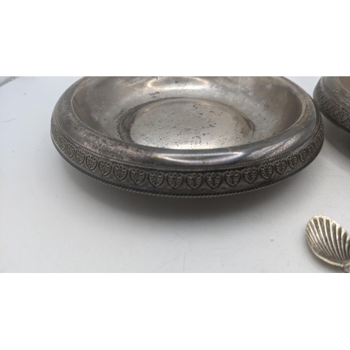 55 - A mixed lot of white metal to include a pair of 900 grade silver dishes 13.5cm diameter along with a... 