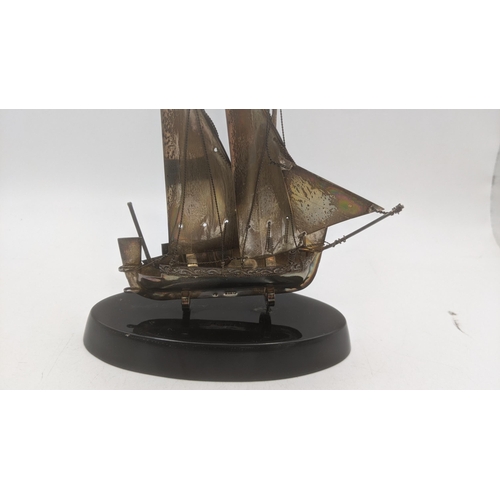 75 - A Maltese 925 silver model of a sailing boat on a ebonised wooden base 13 cm H
Location:6.5
If there... 