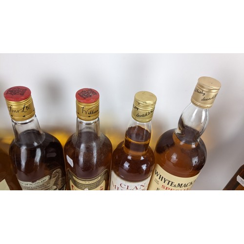 267 - Seven bottles of whisky to include a two William Grants 75cl, a White Horse 23 2/3 FL. OZS, a Clan D... 