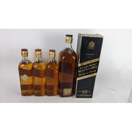 265 - Four bottles of Johnnie Walker whisky to include an Extra Special Black label 12 years with original... 