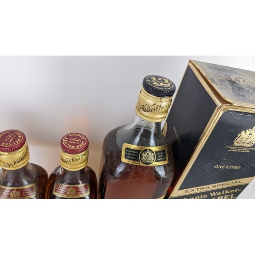 265 - Four bottles of Johnnie Walker whisky to include an Extra Special Black label 12 years with original... 