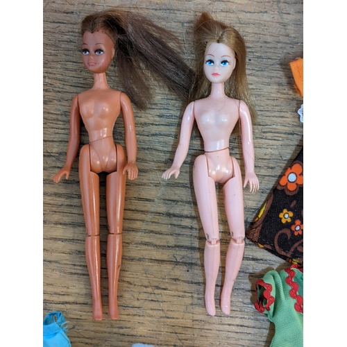 47 - Four vintage Palitoy Pippa dolls with jointed legs and other clothing and accessories 
Location:RAM
... 