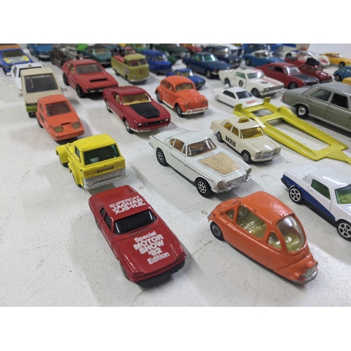 55 - A collection of Corgi model vehicles to include a Lunar Buggy, a Smith's Karrier van, a Ferrari Dayt... 