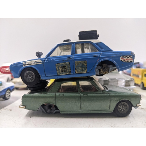 55 - A collection of Corgi model vehicles to include a Lunar Buggy, a Smith's Karrier van, a Ferrari Dayt... 