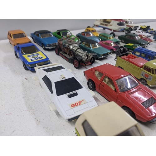 55 - A collection of Corgi model vehicles to include a Lunar Buggy, a Smith's Karrier van, a Ferrari Dayt... 
