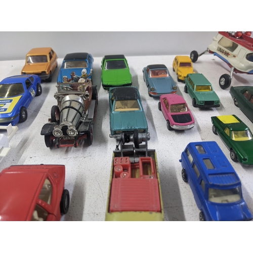 55 - A collection of Corgi model vehicles to include a Lunar Buggy, a Smith's Karrier van, a Ferrari Dayt... 