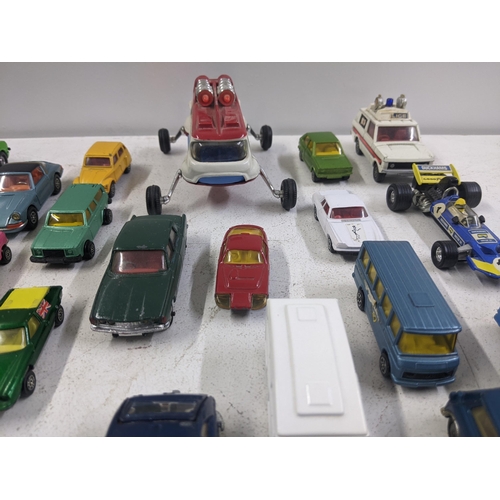 55 - A collection of Corgi model vehicles to include a Lunar Buggy, a Smith's Karrier van, a Ferrari Dayt... 