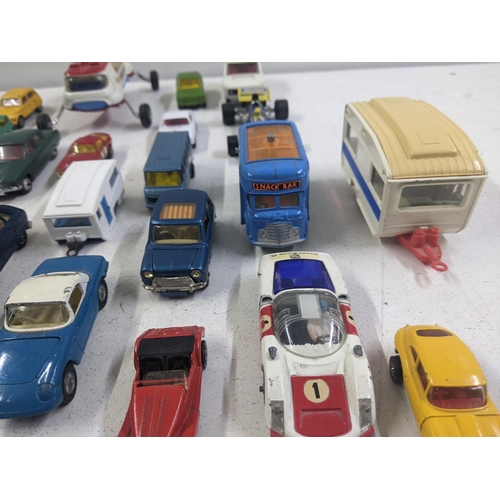 55 - A collection of Corgi model vehicles to include a Lunar Buggy, a Smith's Karrier van, a Ferrari Dayt... 