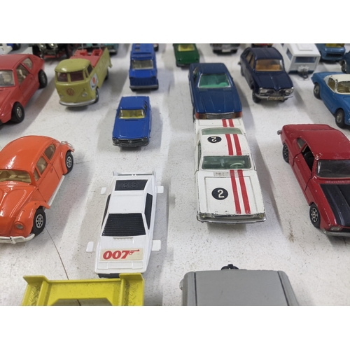 55 - A collection of Corgi model vehicles to include a Lunar Buggy, a Smith's Karrier van, a Ferrari Dayt... 