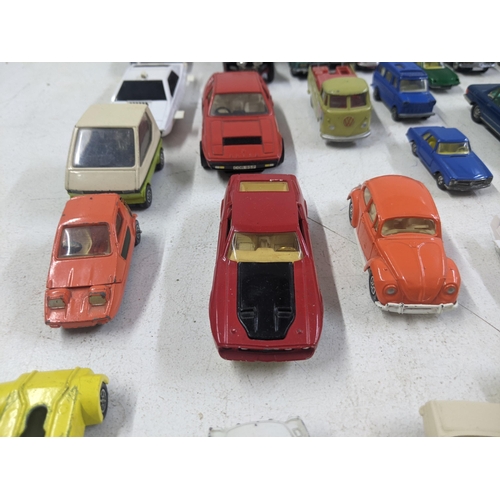 55 - A collection of Corgi model vehicles to include a Lunar Buggy, a Smith's Karrier van, a Ferrari Dayt... 