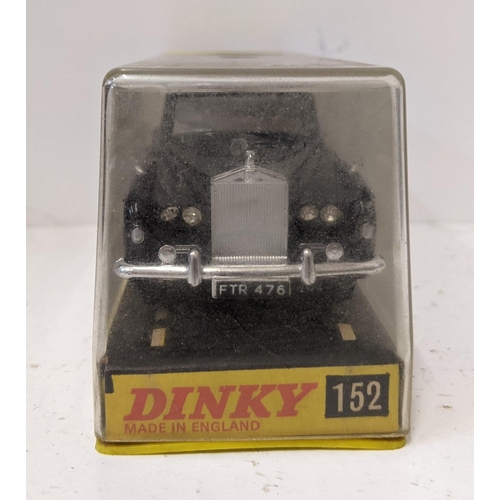 57 - Dinky Toys 152 Rolls Royce Phantom V Limousine, in navy blue with a cream interior with a driver and... 