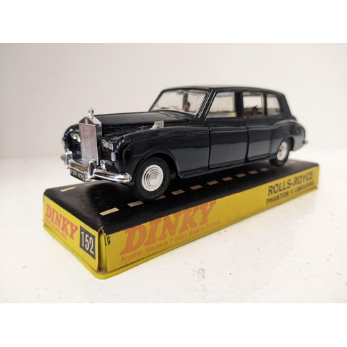 57 - Dinky Toys 152 Rolls Royce Phantom V Limousine, in navy blue with a cream interior with a driver and... 