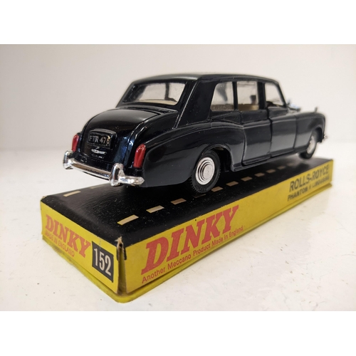 57 - Dinky Toys 152 Rolls Royce Phantom V Limousine, in navy blue with a cream interior with a driver and... 