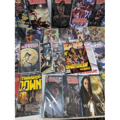 68 - A collection of modern comics to include several editions of Vampirella, Jungle Fantasy, Amazing Fig... 