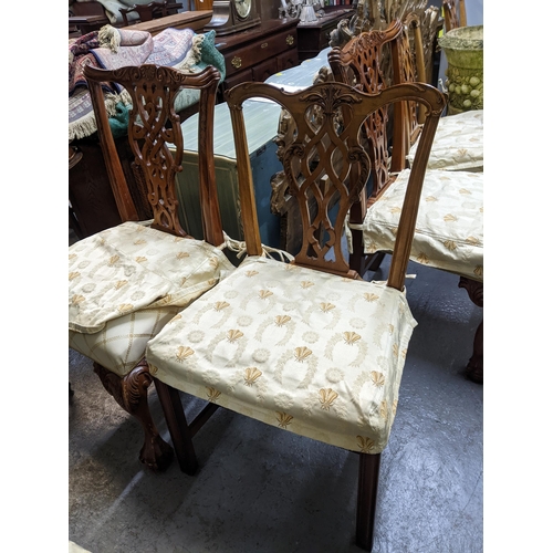 103 - A set of four Frank Hudson of High Wycombe reproduction mahogany dining chairs with upholstered over... 